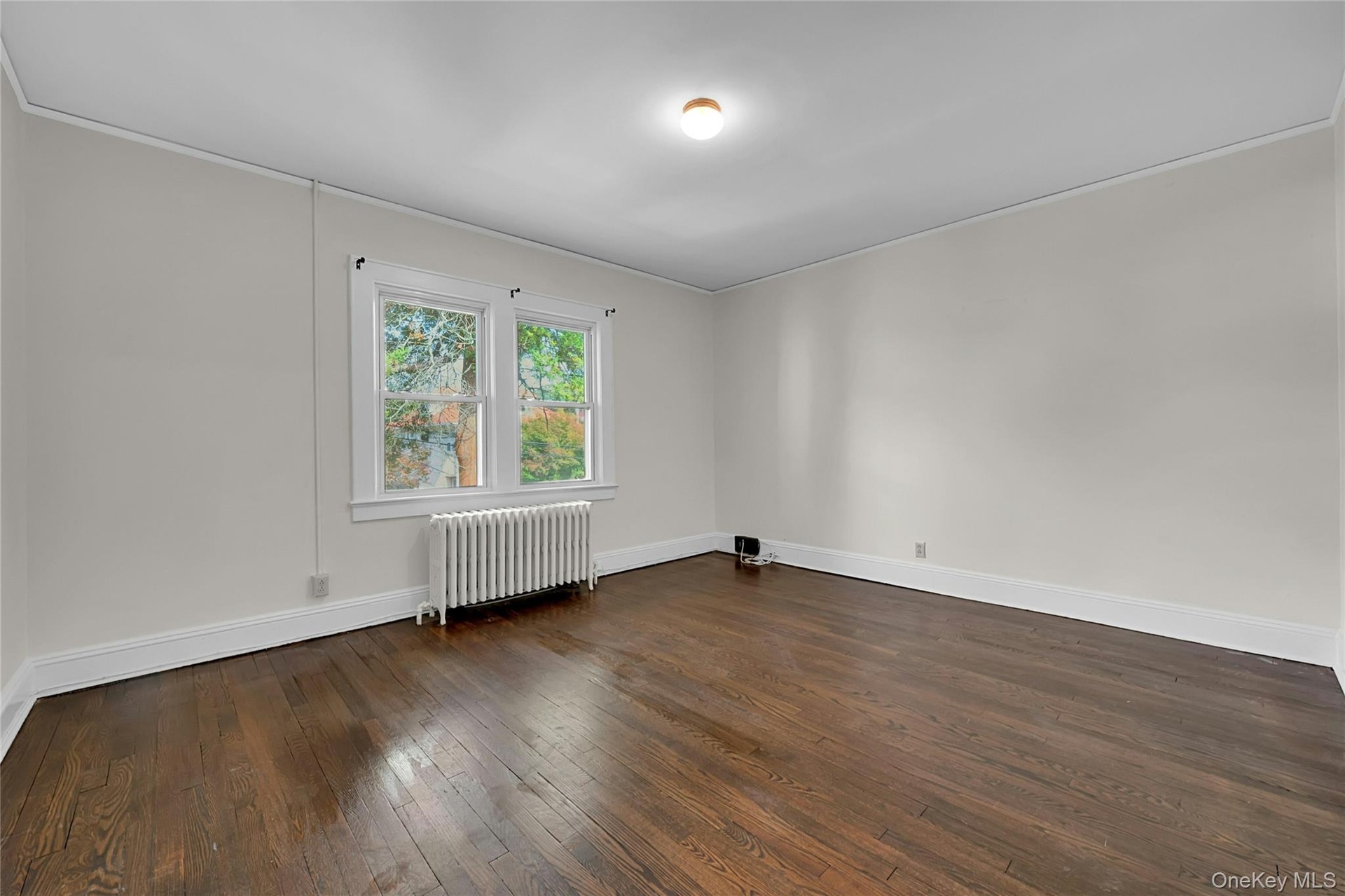 The larger of the two rooms. Bedroom or Living Room / Office, you choose