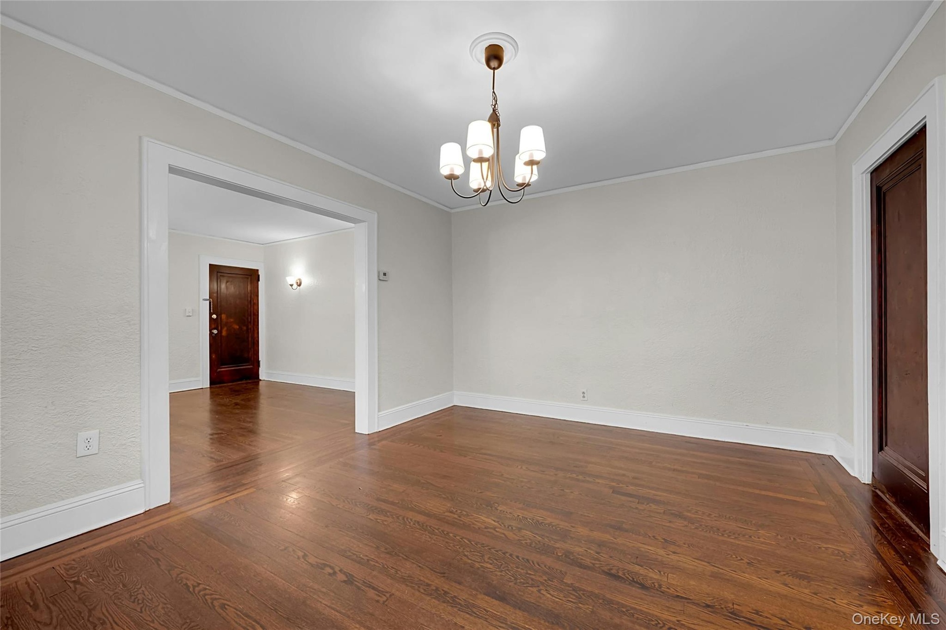 Another large room on main-level. Front door to left, door to Kitchen on right