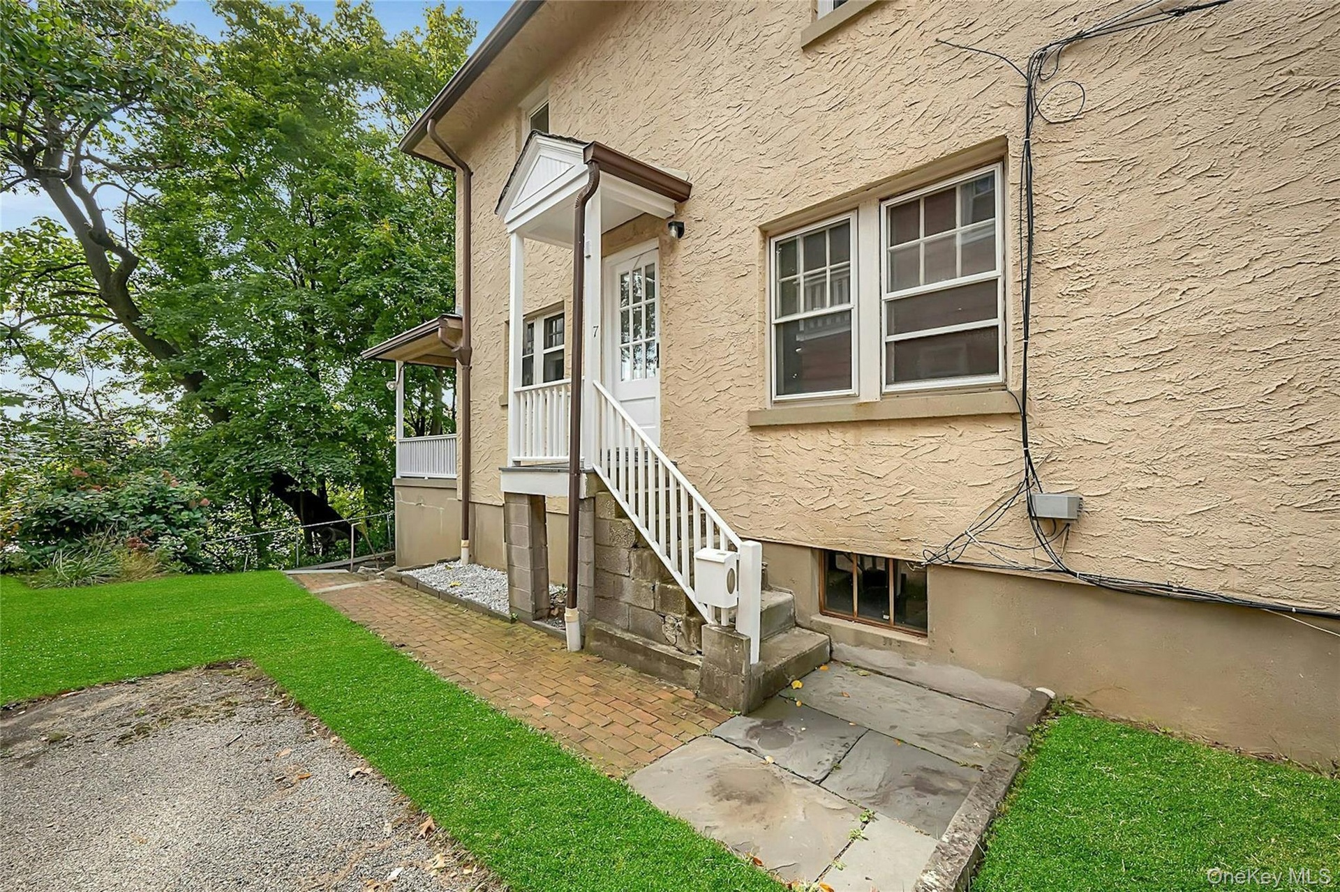 Entrance to 1-bed top floor unit