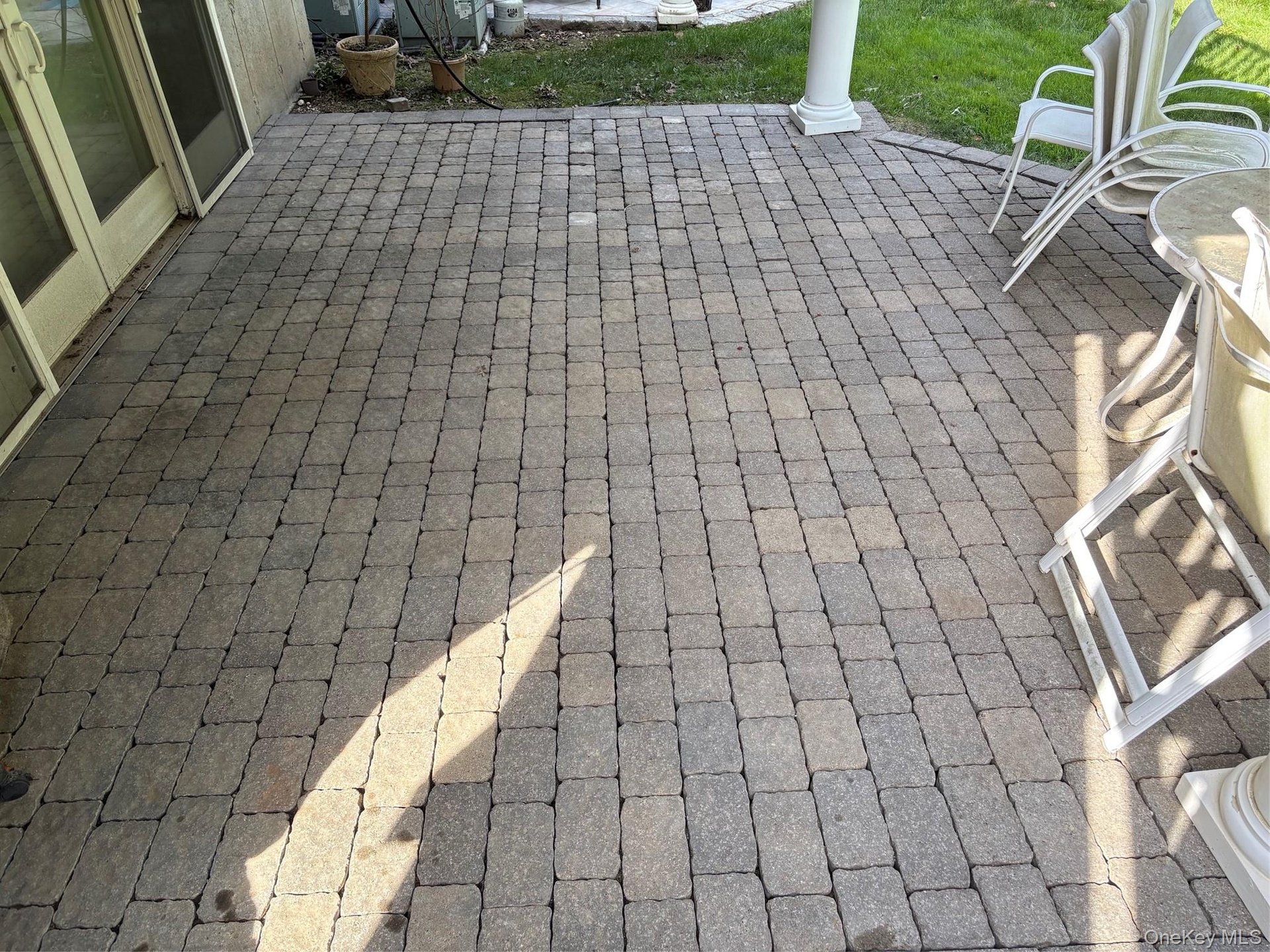 Paver Patio off Sliders and the Den on the Lower Level