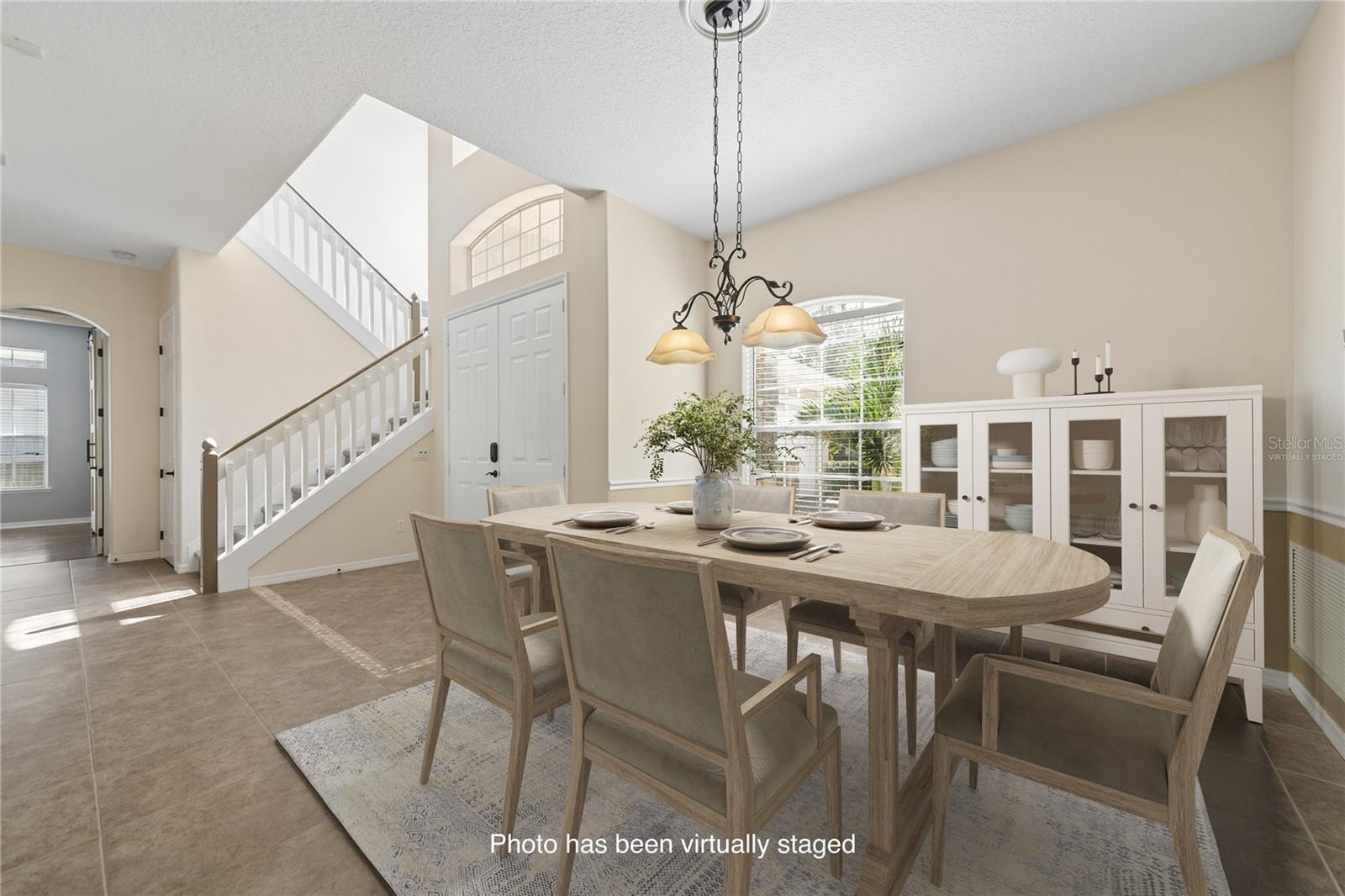 With the open concept your formal dining room will feel very spacious (photo virtually staged).