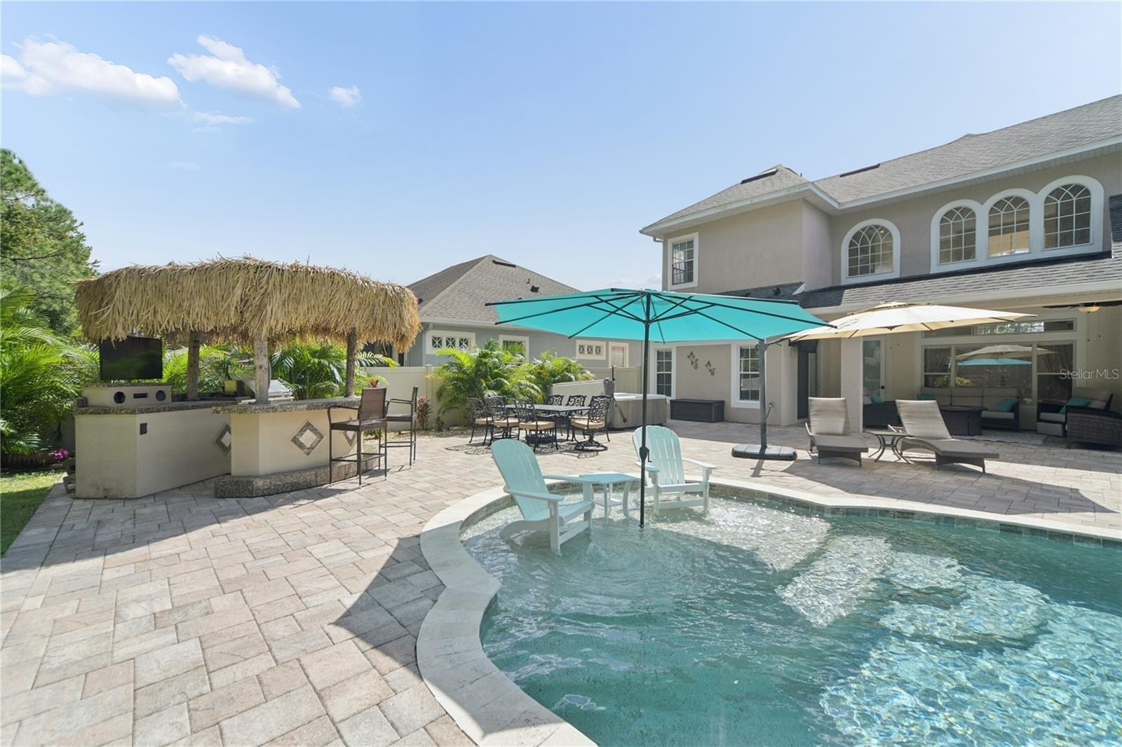 This is the sun shelf with an umbrella receptacle, it's 9 ft wide with enough room for chairs and others to enjoy the shallow water to cool off. Right