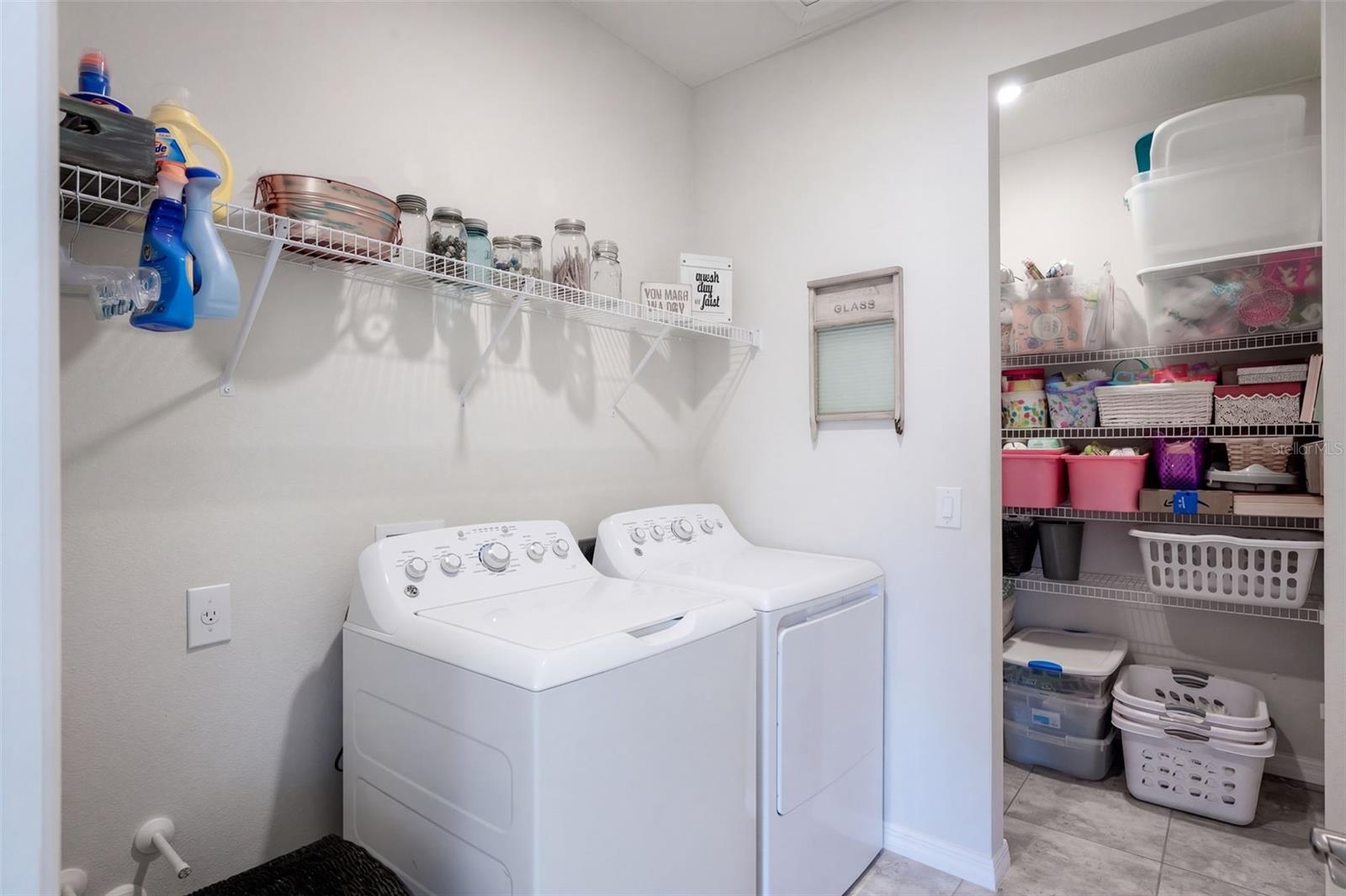 Laundry room with extra storage closet and plumbing hookups for uitlity sink