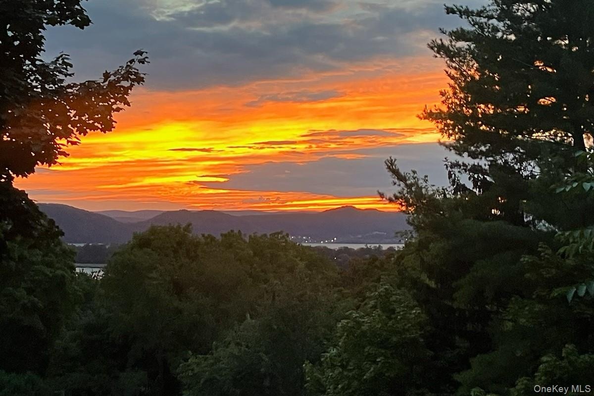 Enjoy beautiful Hudson River sunset views from the dining room, or step out onto the spacious deck for outdoor dining, entertaining, and taking in the