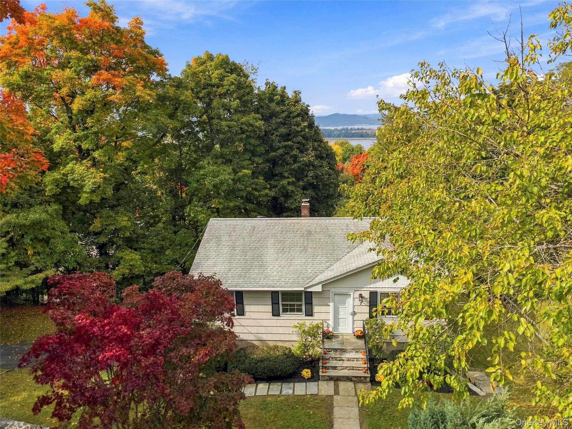 Front view of the home showcasing its charming exterior and beautiful Hudson River views.