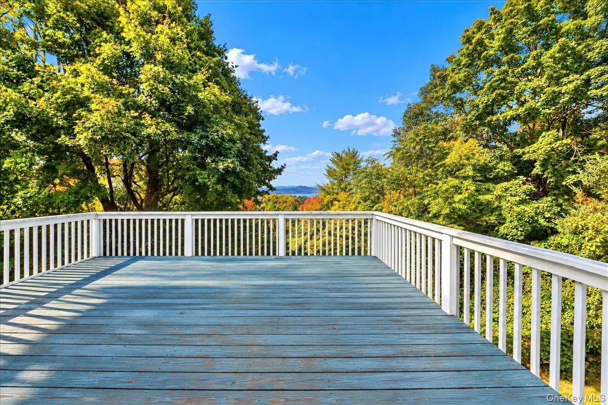Spacious deck overlooking the beautiful Hudson River, perfect for entertaining guests, enjoying your morning coffee, or unwinding while taking in the 