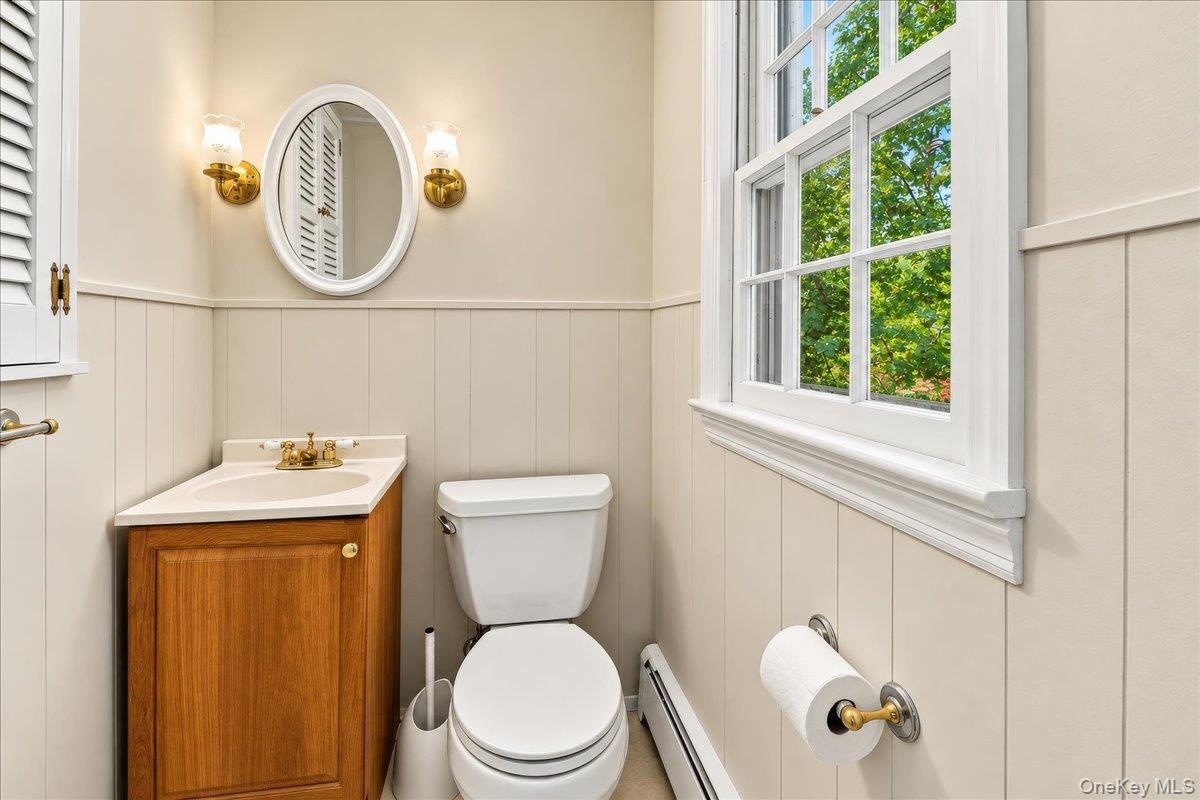 Conveniently located and updated lower-level half bath, easily accessible from both the recreation room and family room.