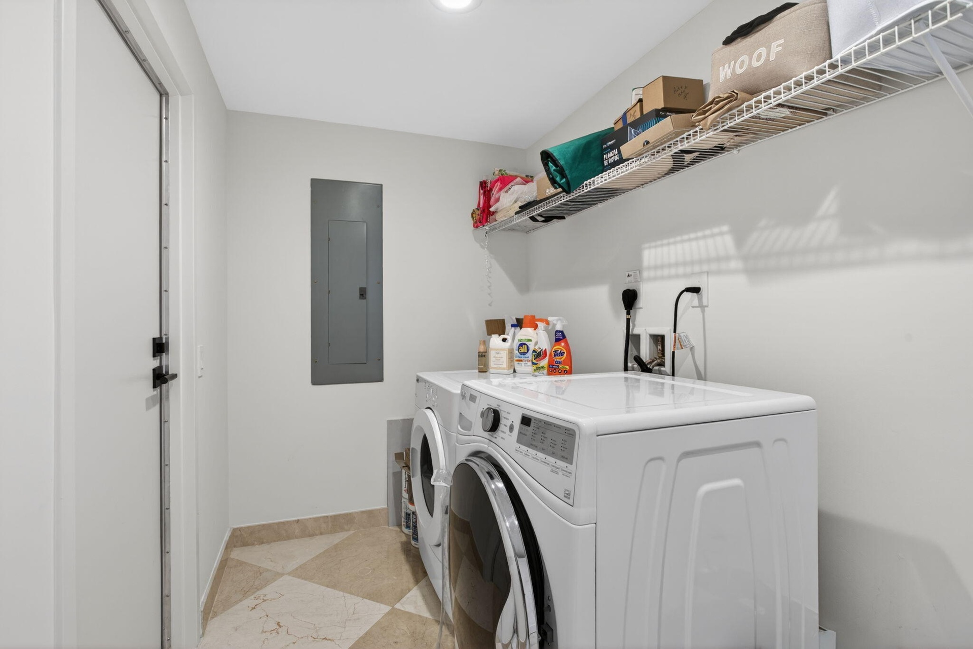 Full sized laundry room with private back entrance