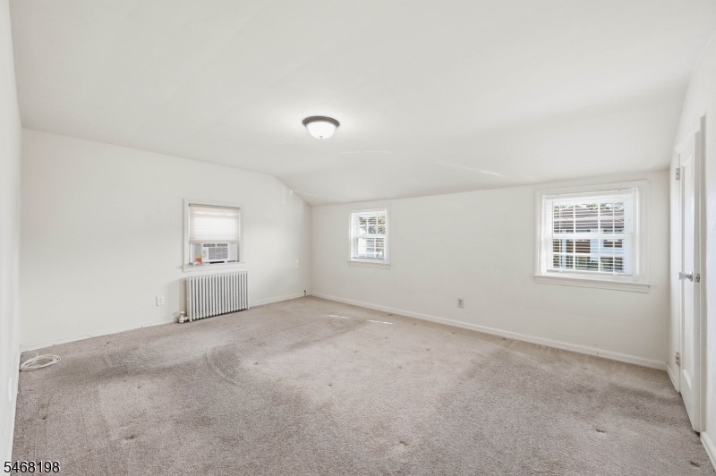 Primary Bedroom with carpeting
