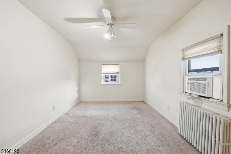 2nd bedroom with carpeting