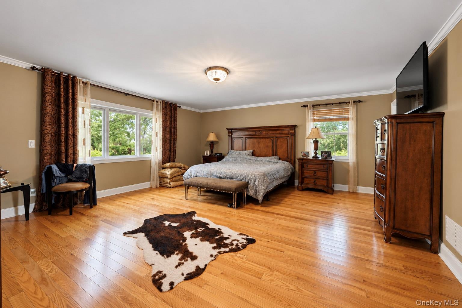 Wood-finish flooring, multi-pane windows, and crown molding