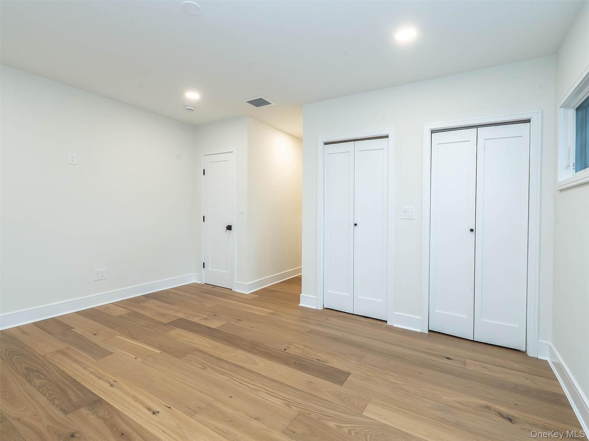 1st Floor: Primary bedroom w/3 closets