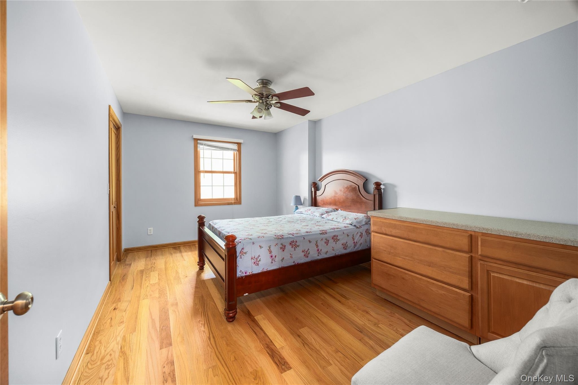Bedroom with light wood-type flooring and ceiling fan