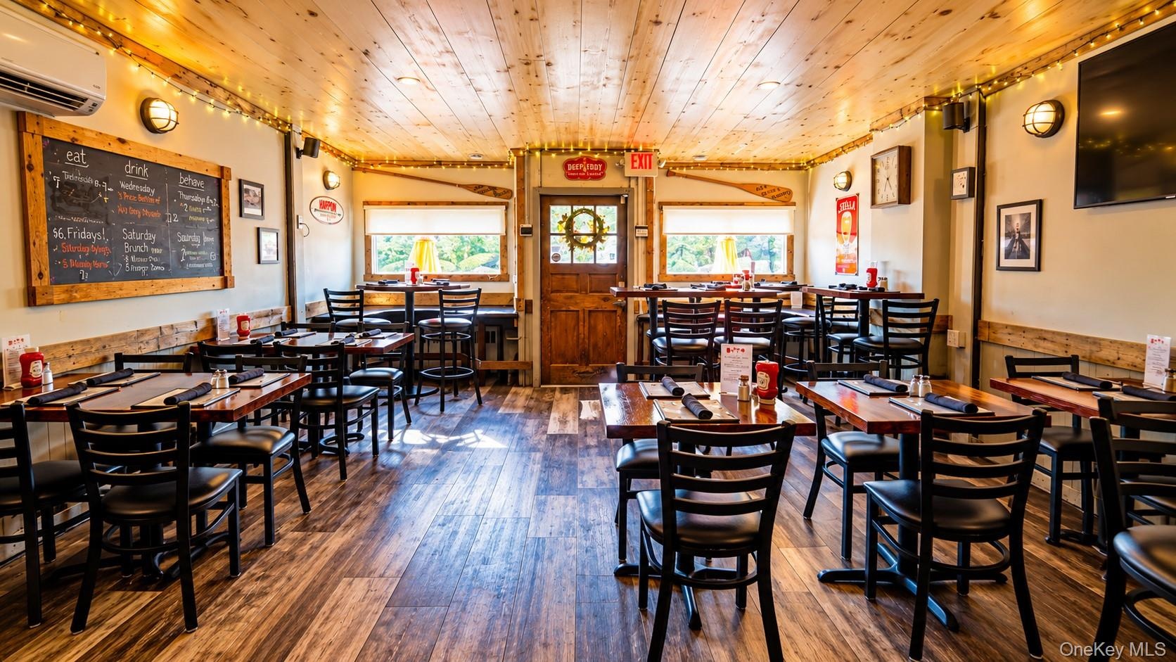 WritingAnother inviting view of the Tavern’s indoor dining area, where great food, warm hospitality, and a welcoming atmosphere have brought the commu
