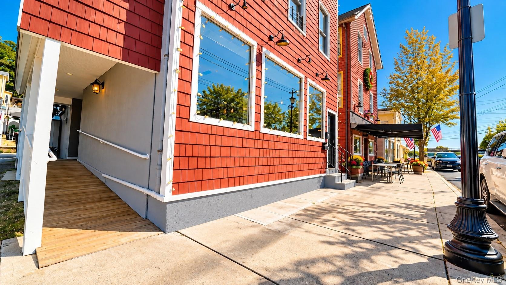 Another view of 43 North Riverside Avenue showcases the building’s convenient layout, featuring a private front entrance for the residential apartment