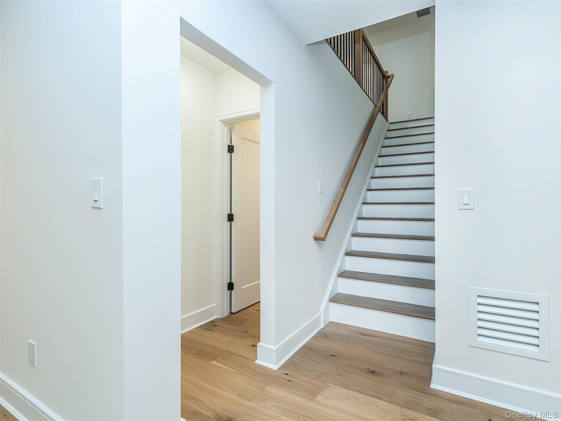 Stairs leading to the 2nd floor with an additional 2 beds + 1 bath