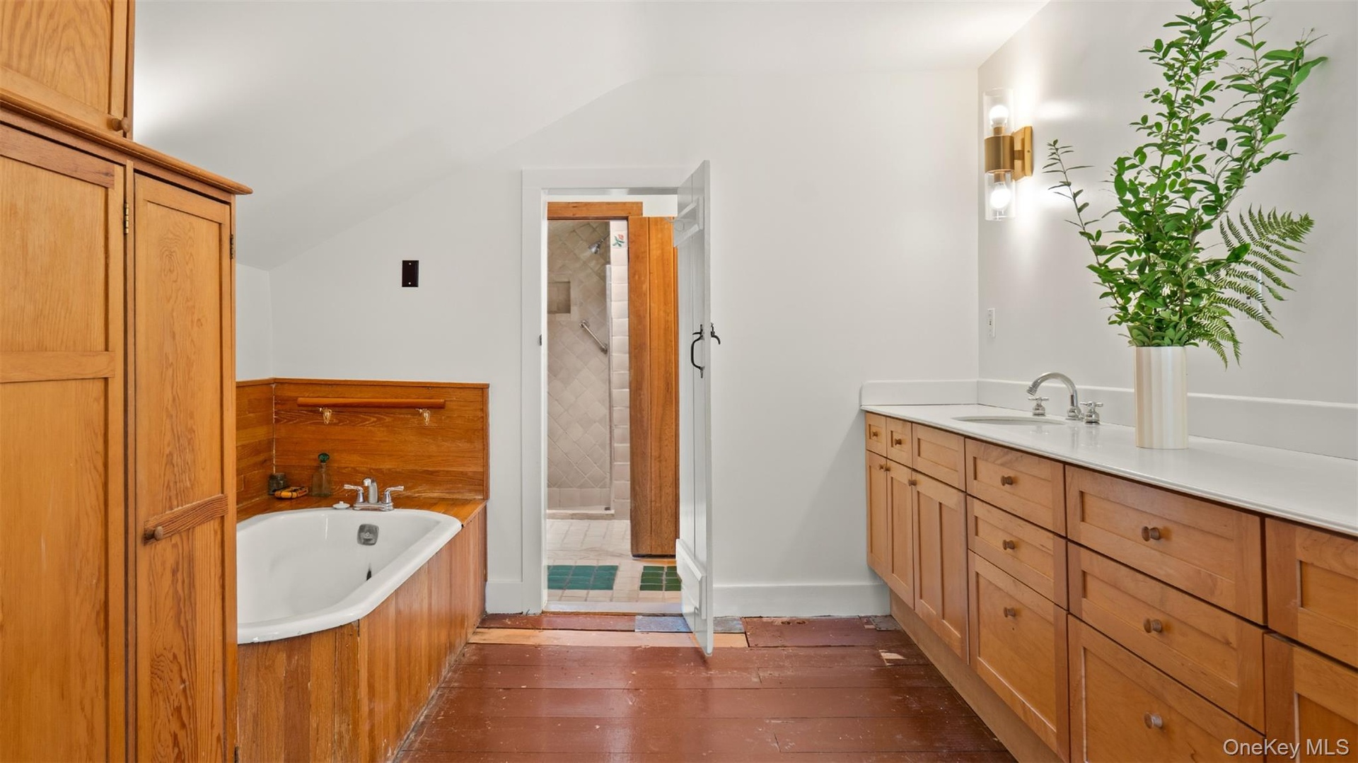 Primary bedroom en suite bath with soaking tub, shower and sauna.