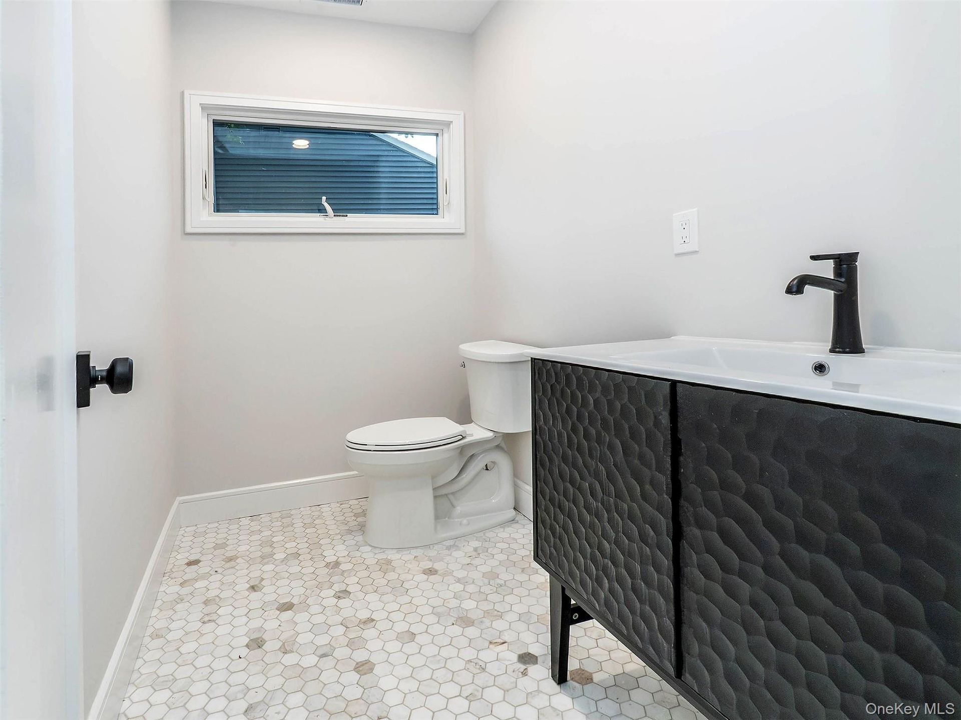 1st Floor: 1.2 bath off the kitchen hall.