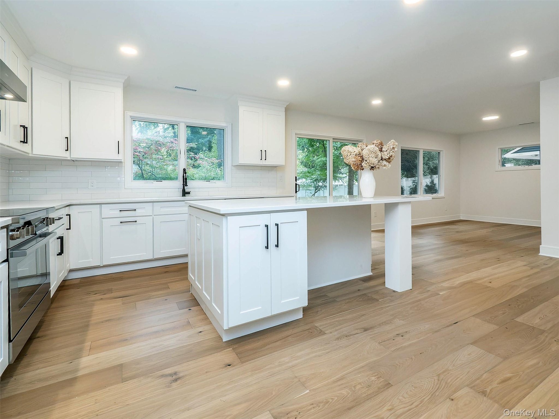 LARGE island for prepping and SMART seating that wraps the corner for ease of conversation