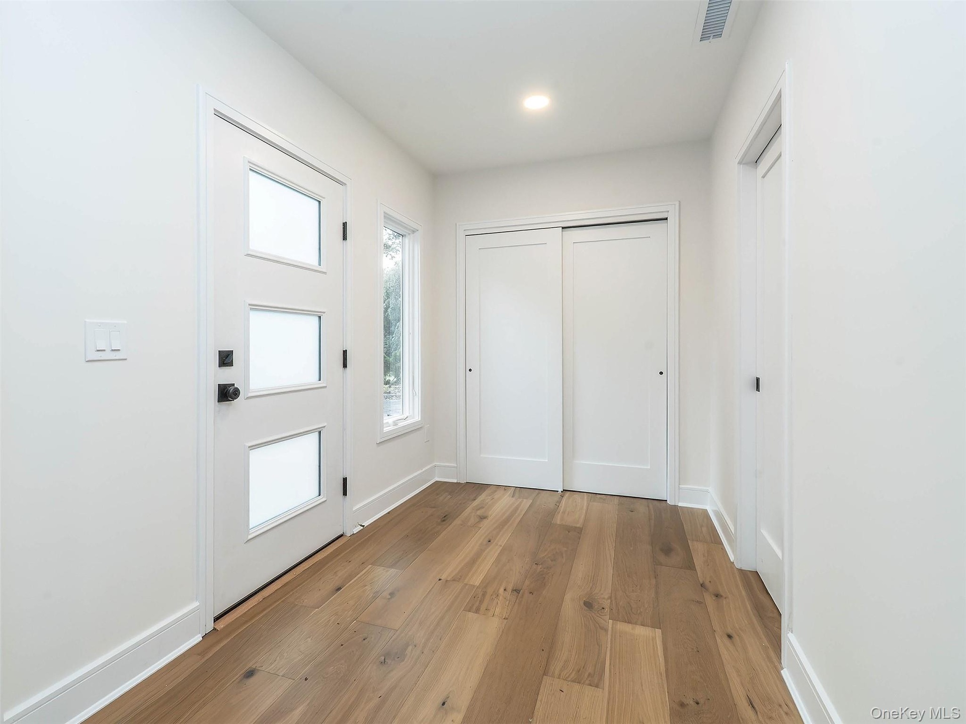 Entry way with large coat closet