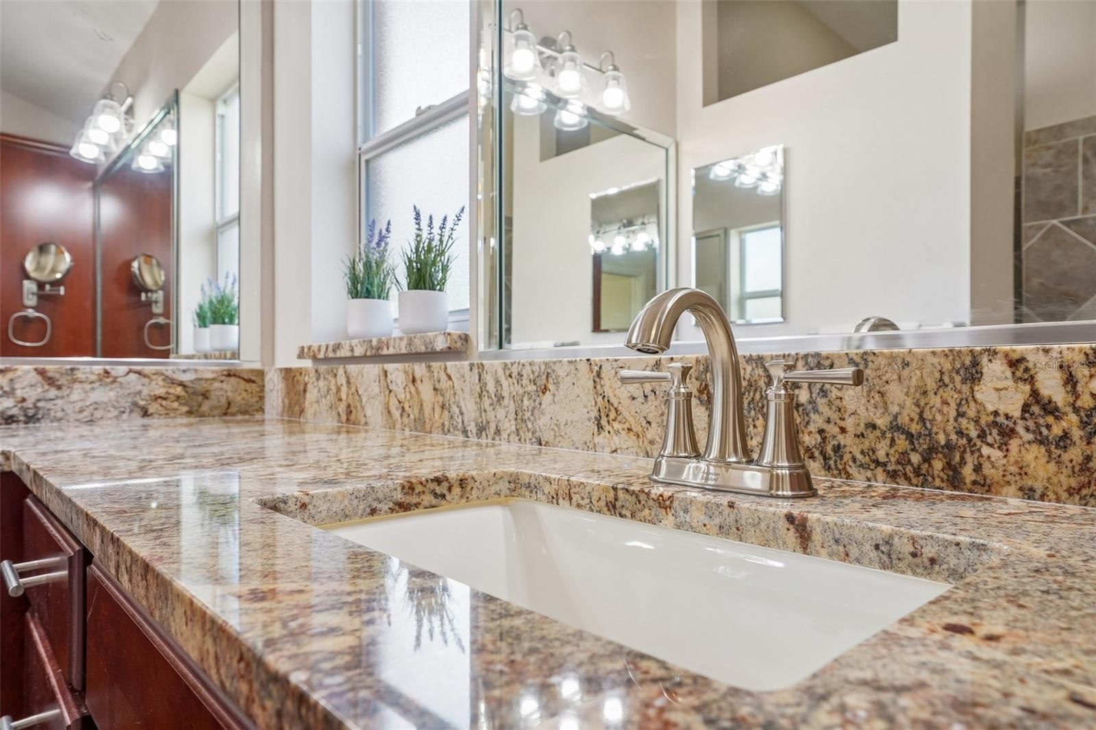 Primary Bathroom with New Faucets, Sinks and Granite Countertops