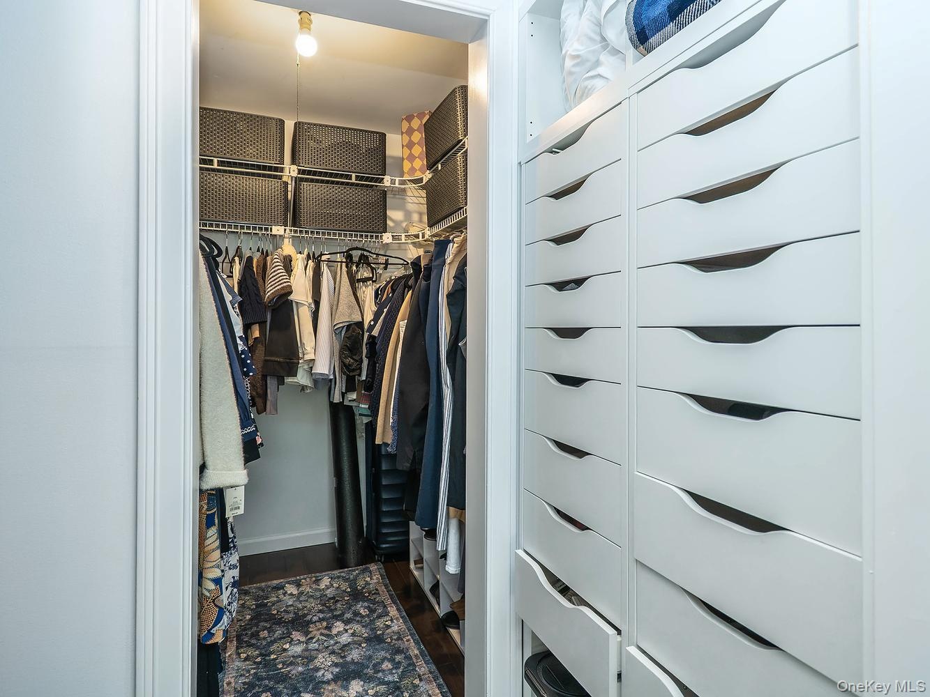Walk in closet attached to primary bedroom