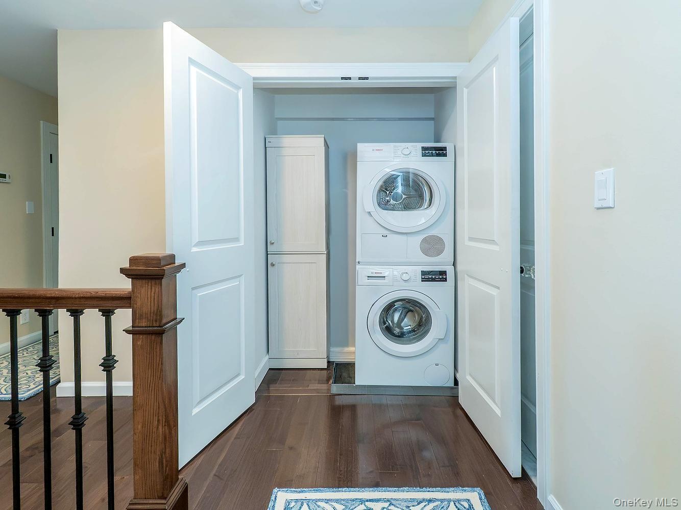 Stackable laundry hallway on second floor