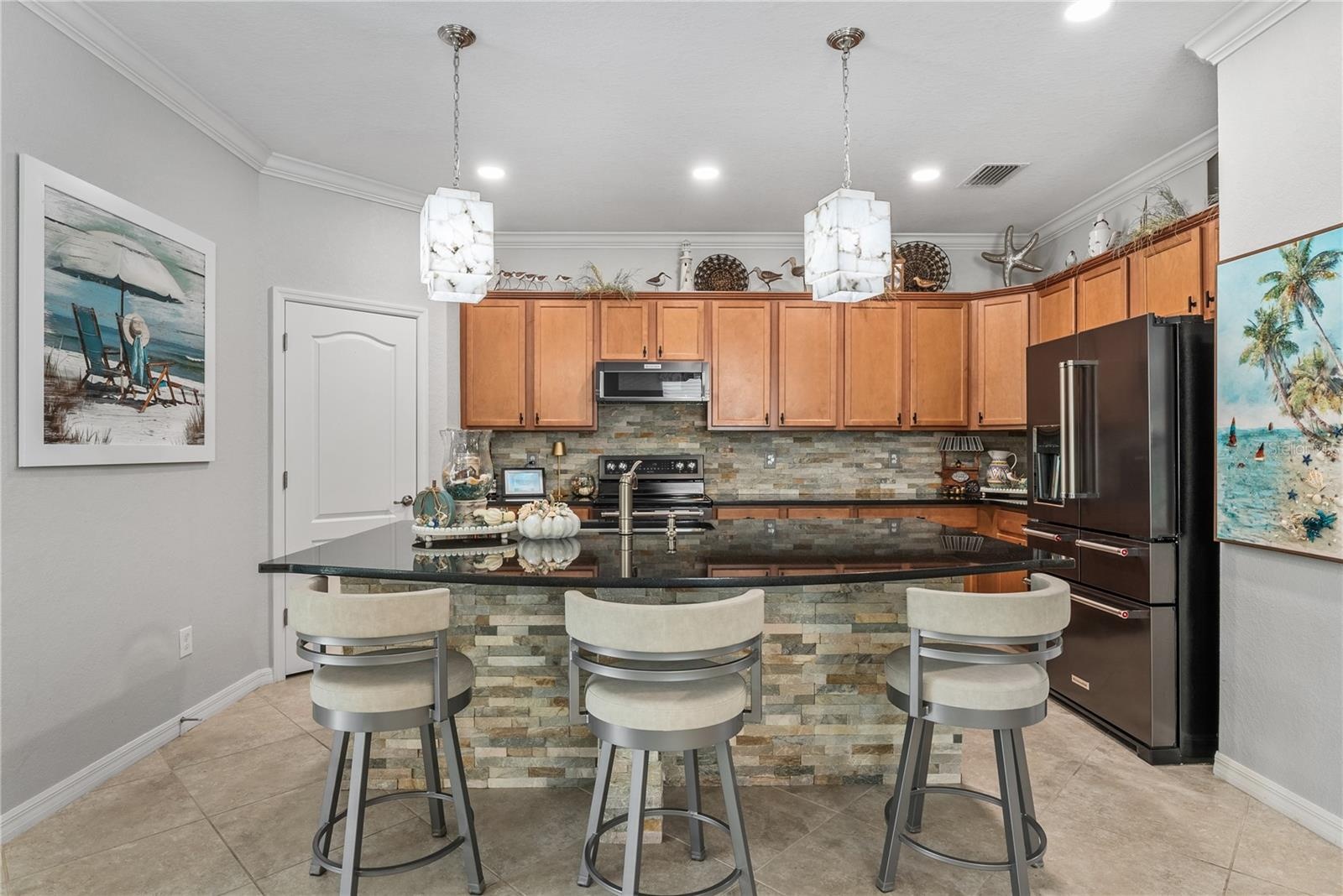 Kitchen with large island and beautiful lighting