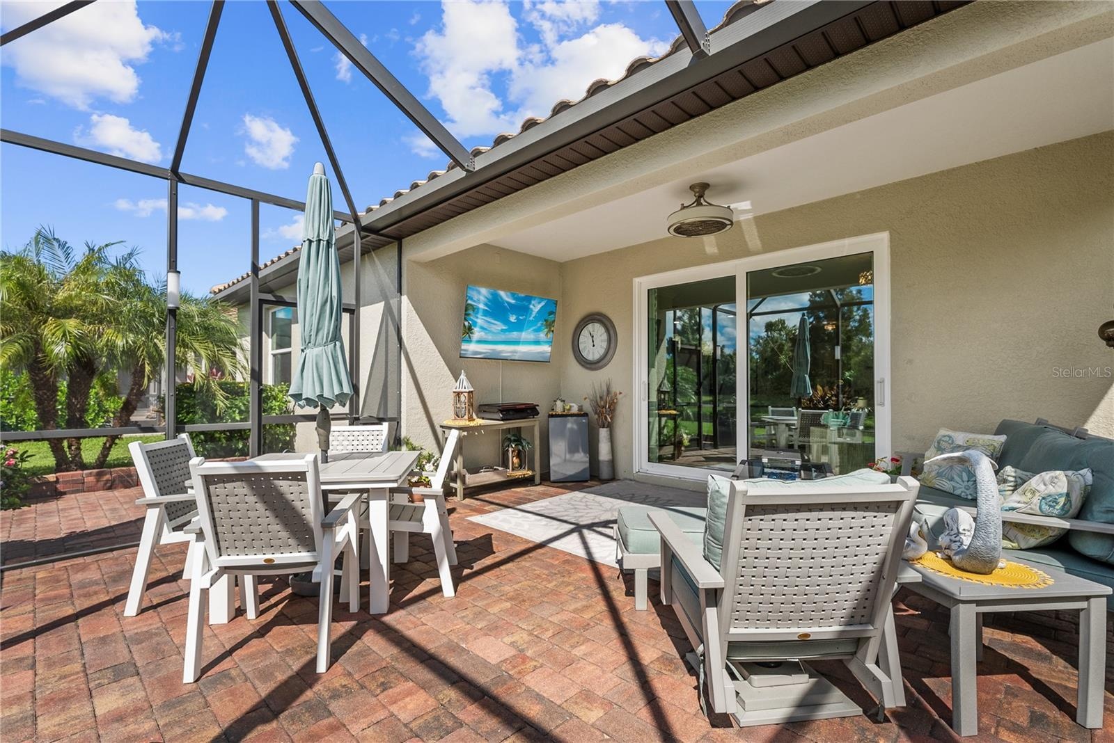 Huge outdoor patio with pavers inside lanai and outside patio too