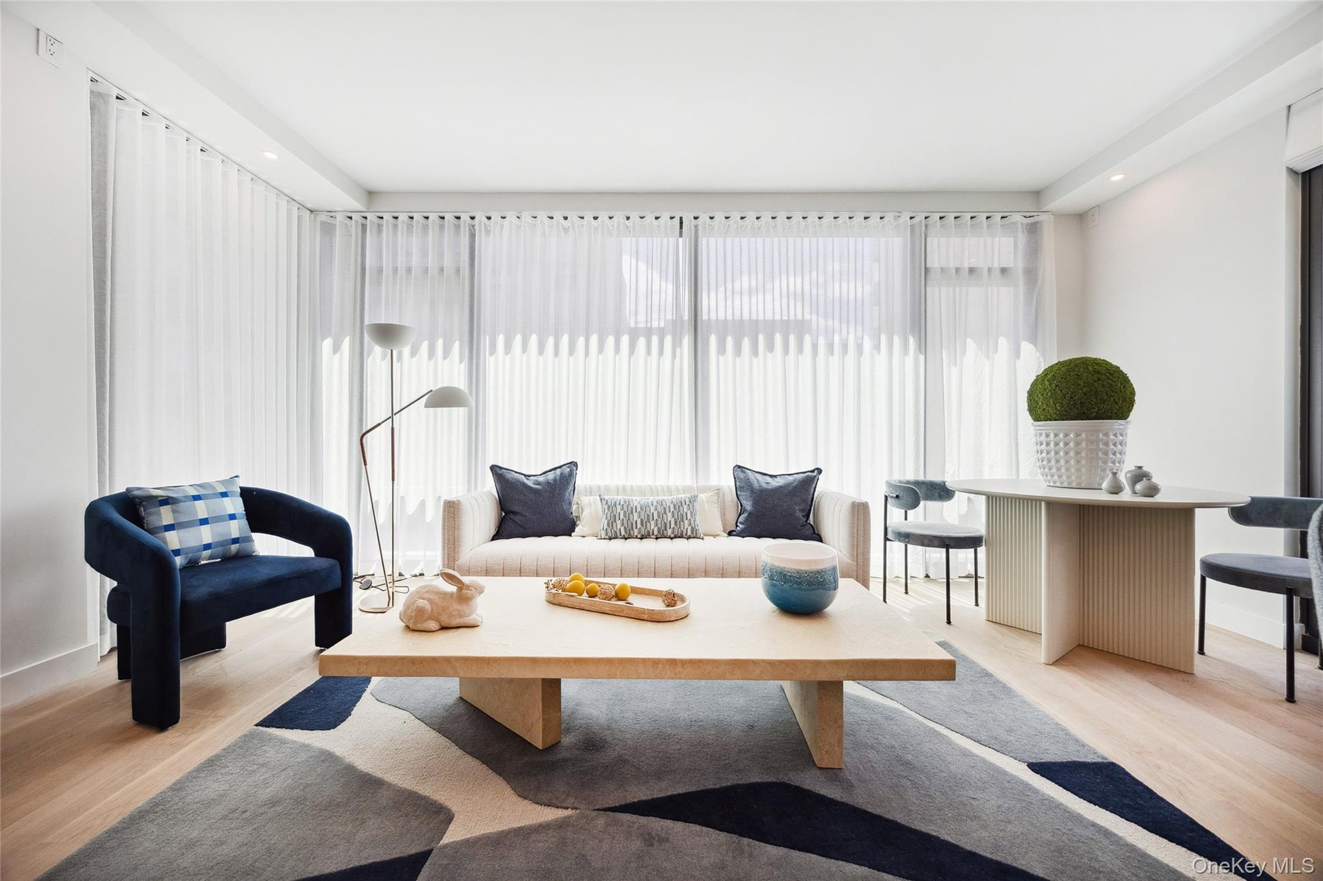 Sitting room with light wood-style flooring