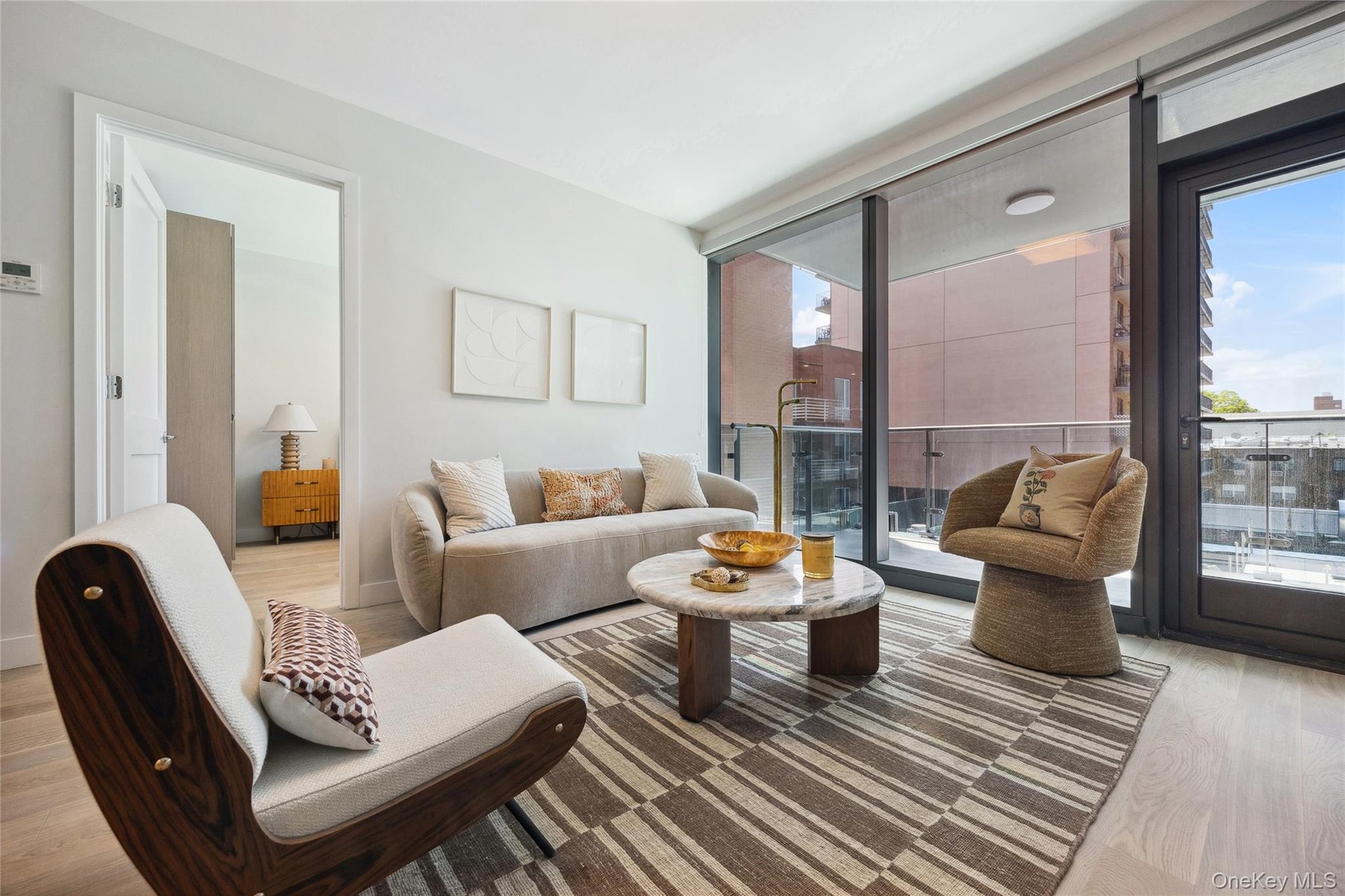 Living room with light wood finished floors and plenty of natural light