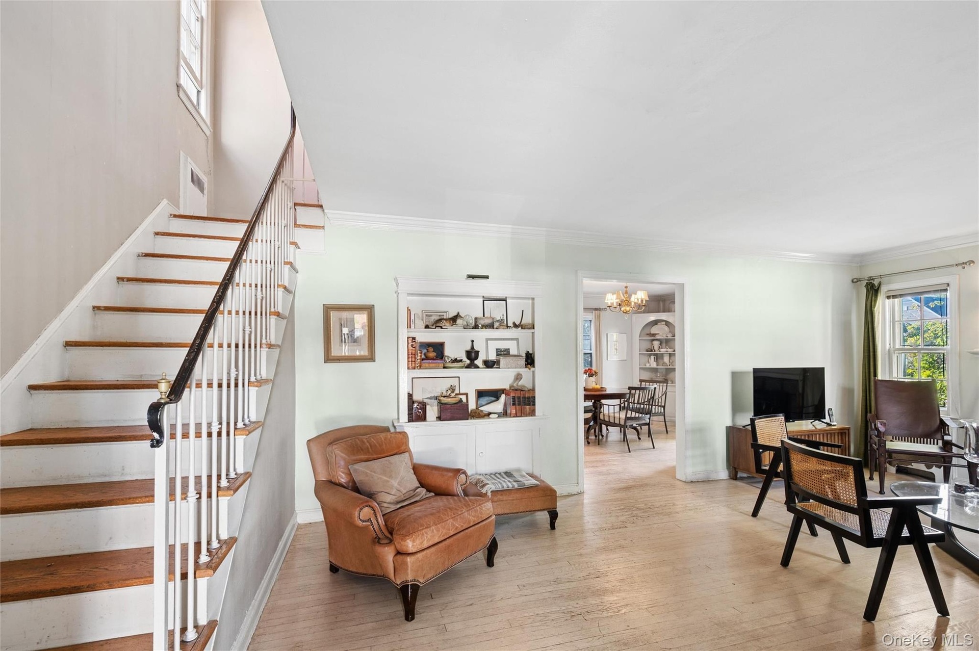 Living room at entrance and stairs to bedrooms