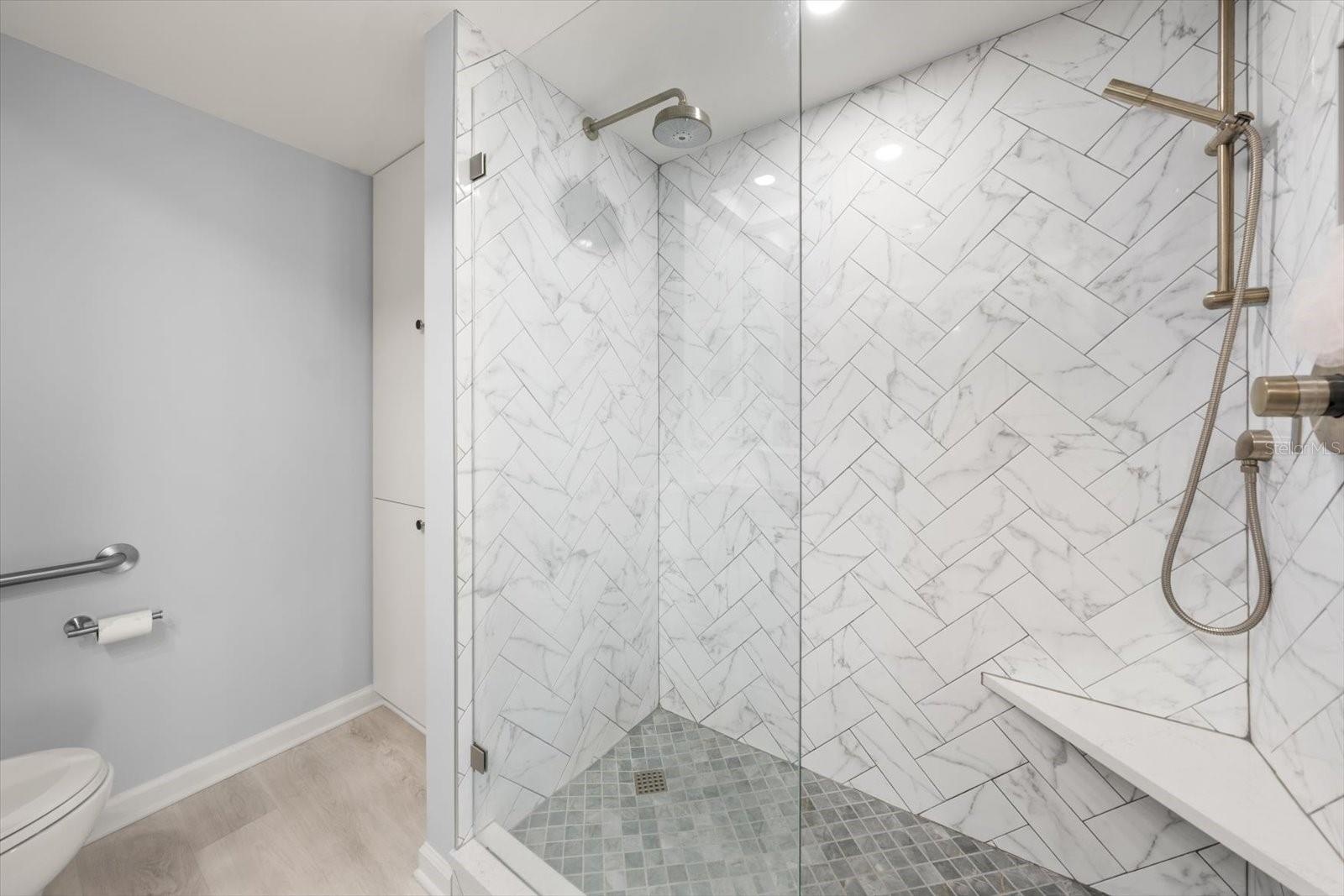 Exquisite shower in primary En suite bath is an oasis in itself.