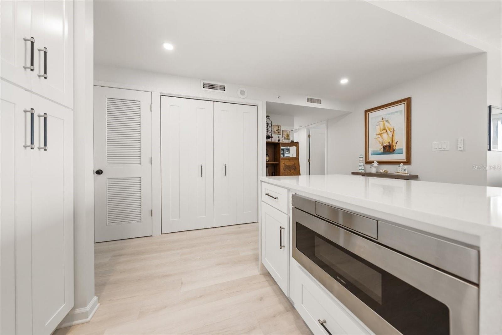 Built in microwave in kitchen island to efficiently free up cabinet & counter space.