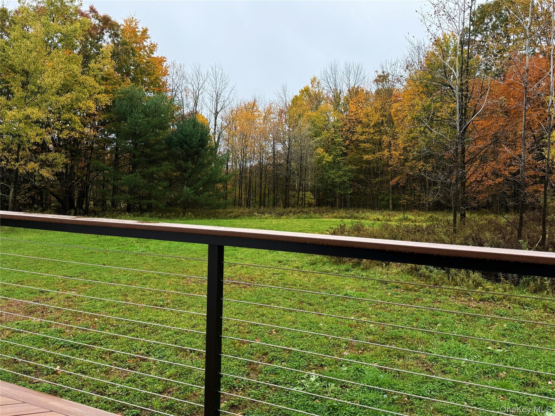 step out of main living space to your wraparound deck and inhale deeply