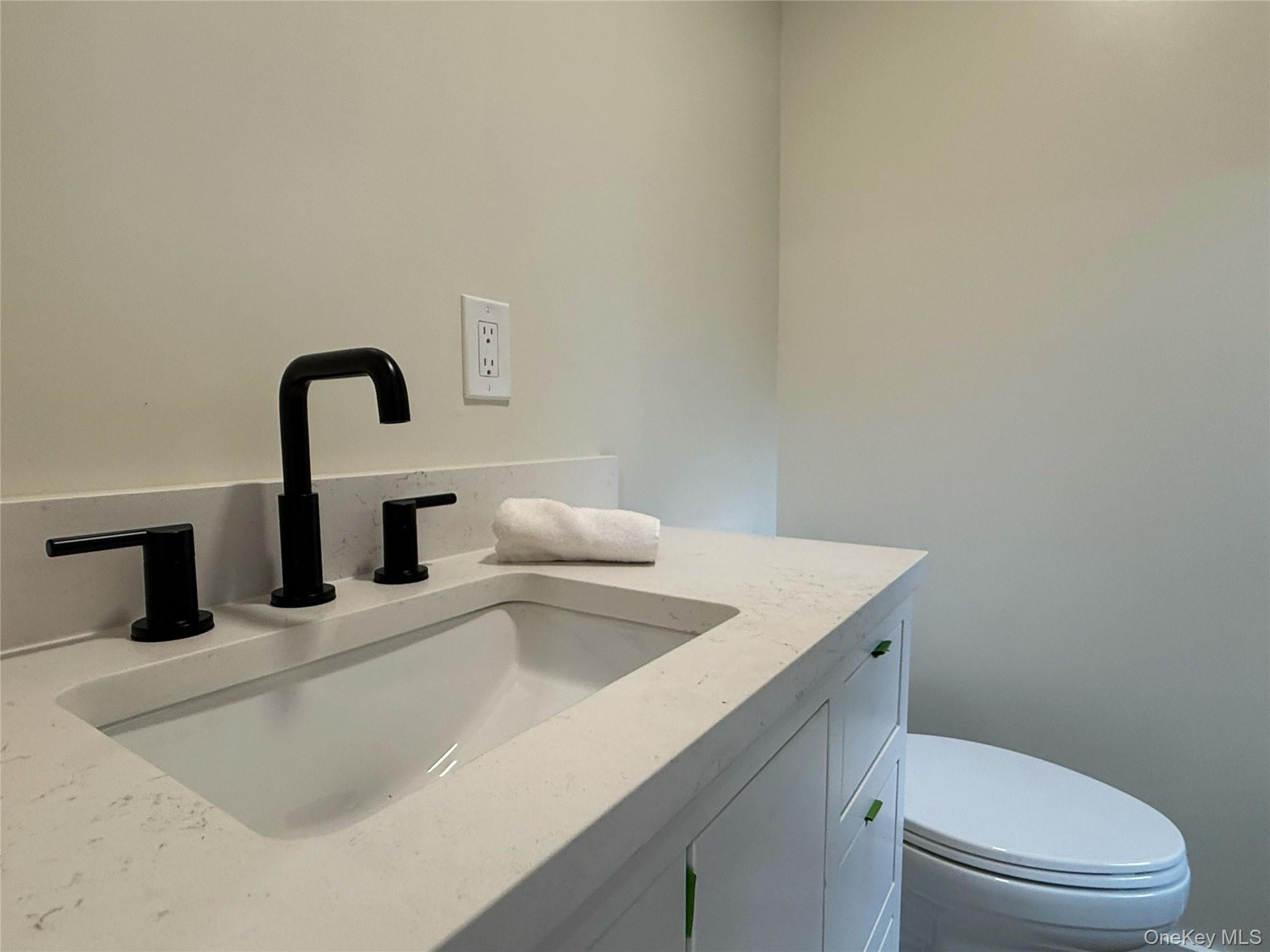 primary suite bathroom with custom designed shower