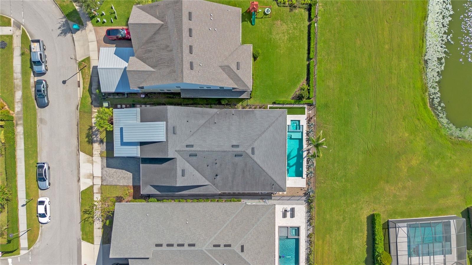 Overhead aerial showing the home, private pool, and fenced backyard.