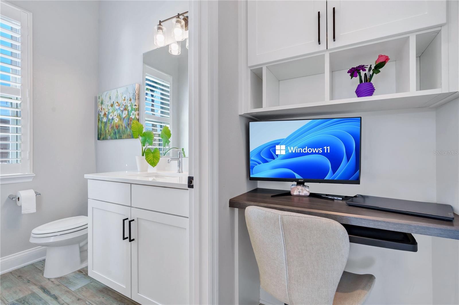 Built in office nook with desk and shelving, a functional workspace for working from home.