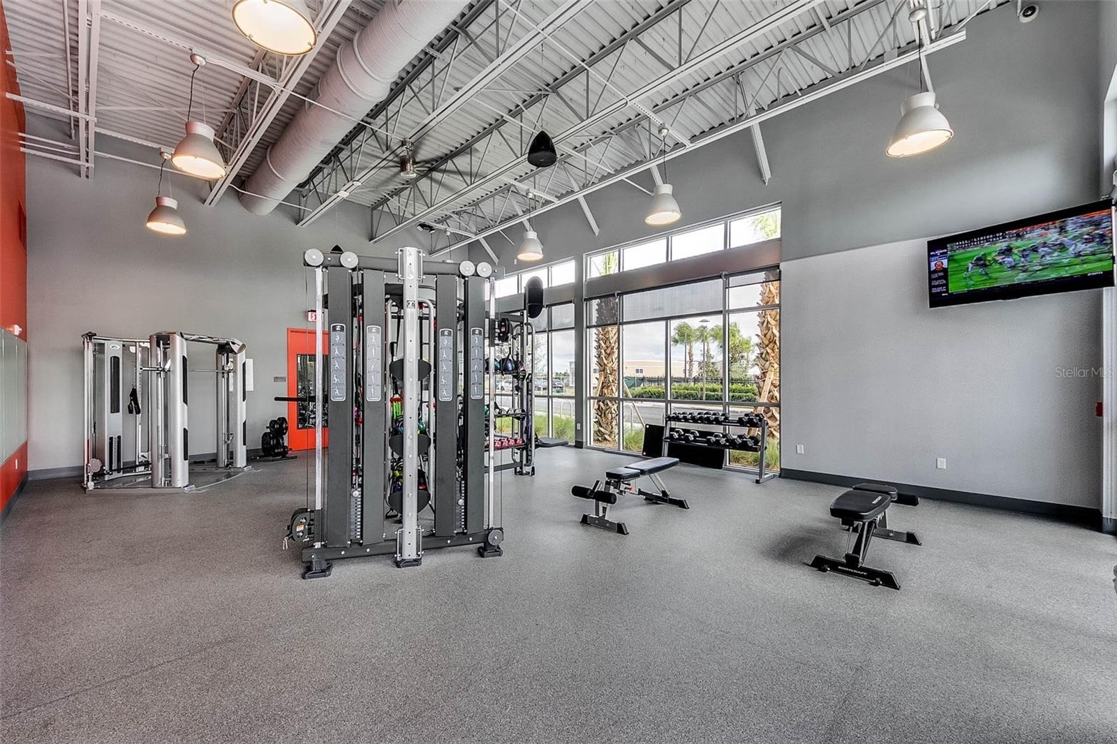 Community fitness center with strength training equipment and modern design.