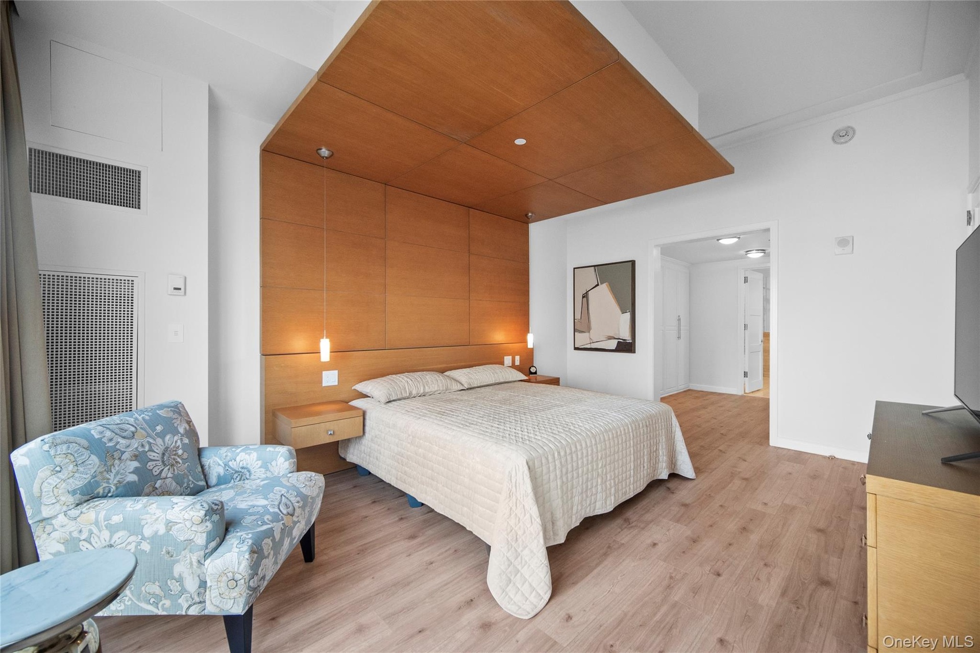 Bedroom with light wood finished floors, recessed lighting, and baseboards