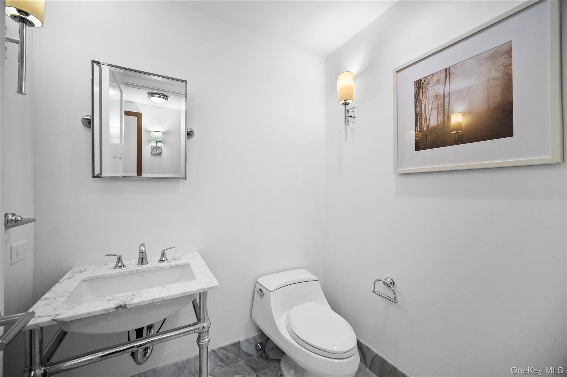 Bathroom featuring marble finish floors and toilet