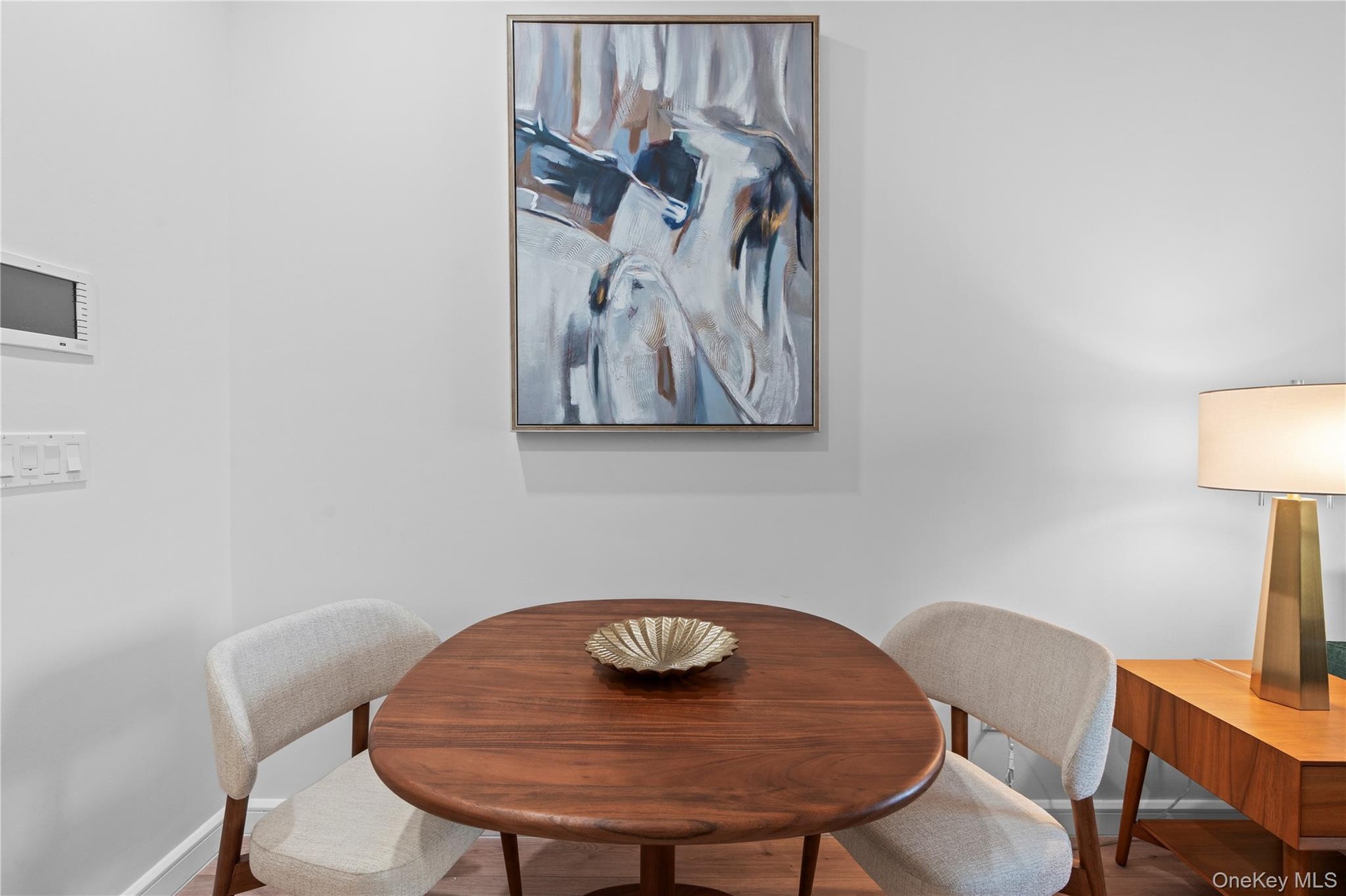 Dining space with baseboards and wood finished floors