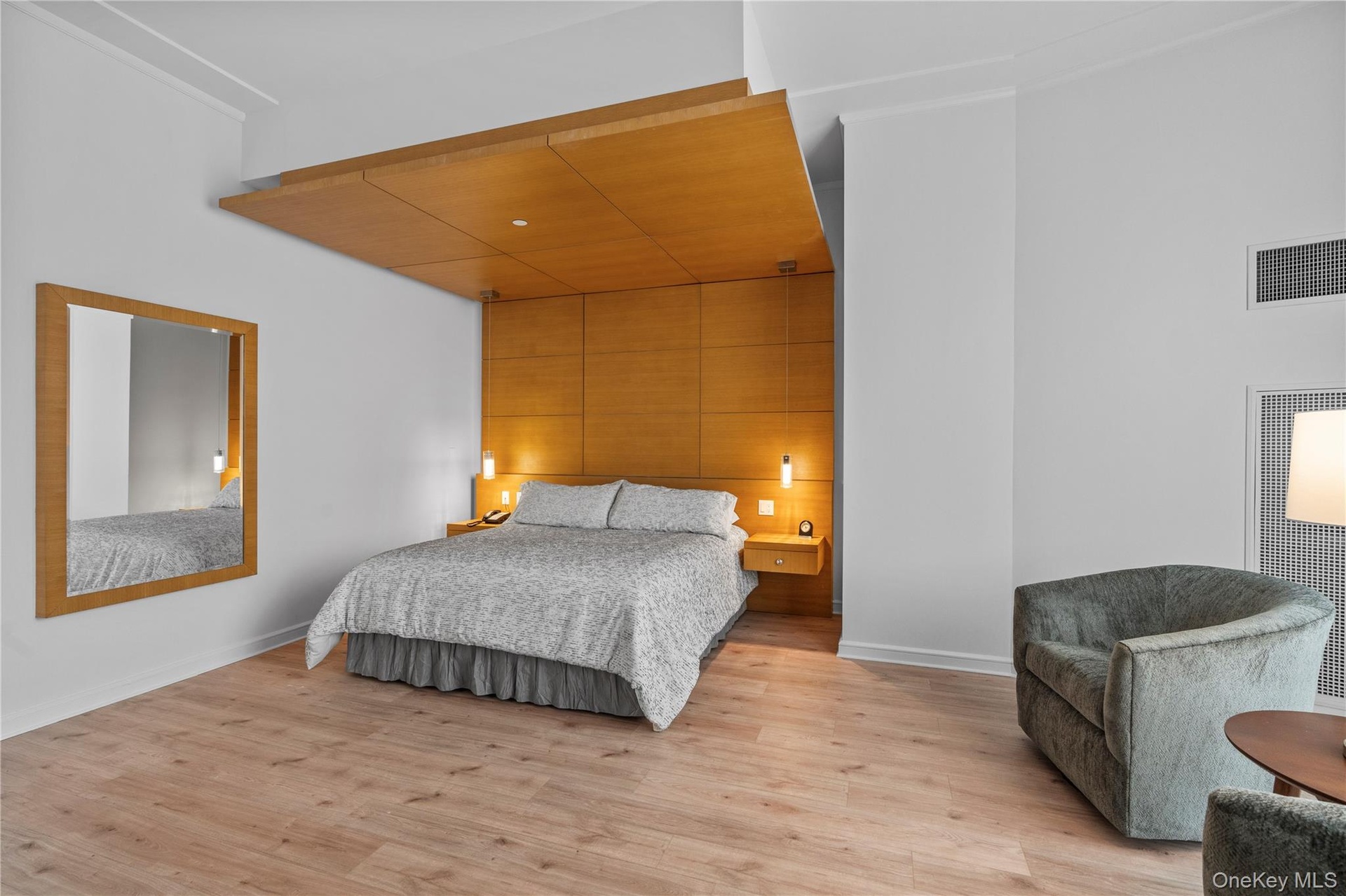 Bedroom featuring baseboards, visible vents, and light wood-style floors