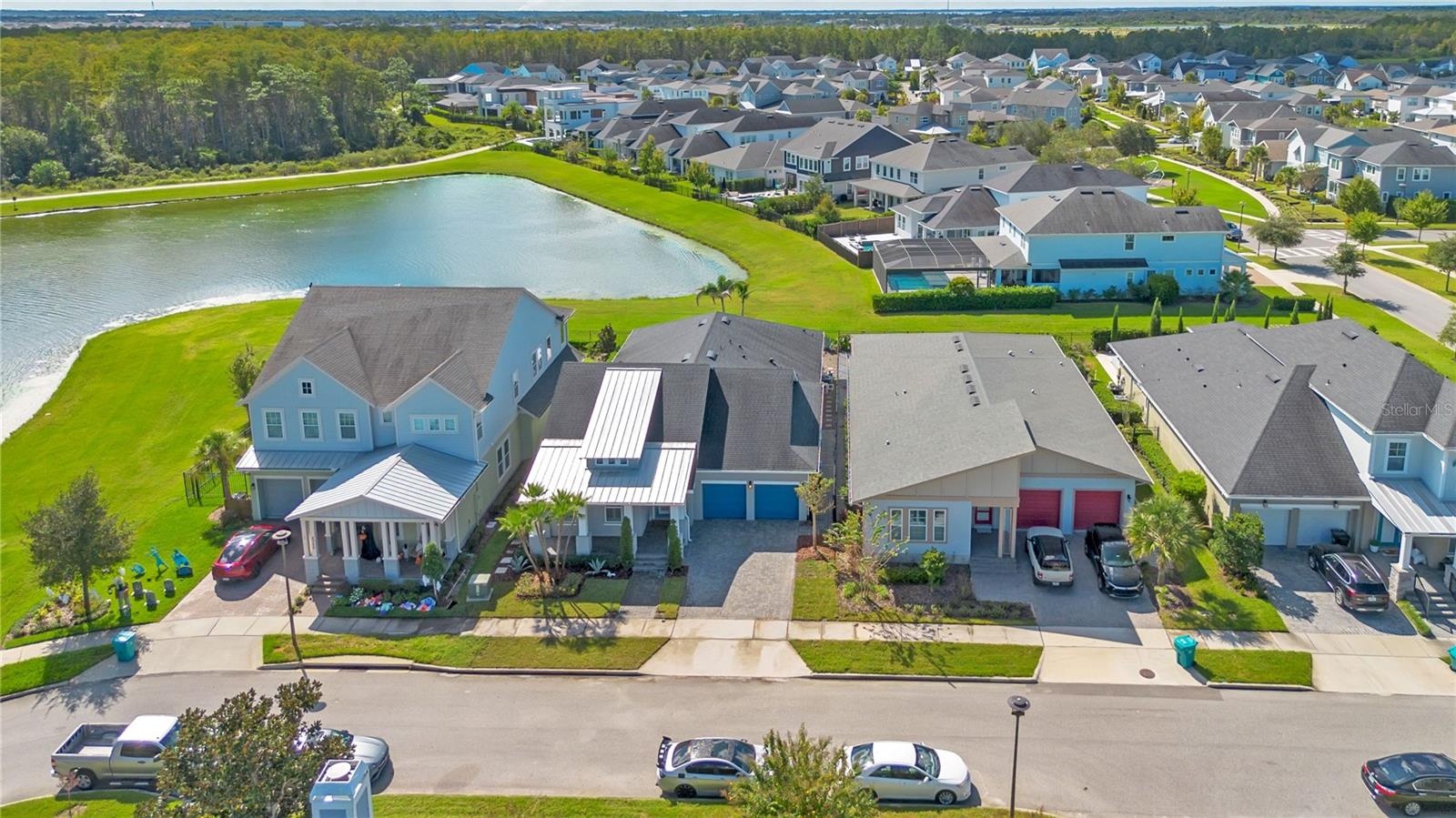 Aerial of the home along the pond with water and conservation views.