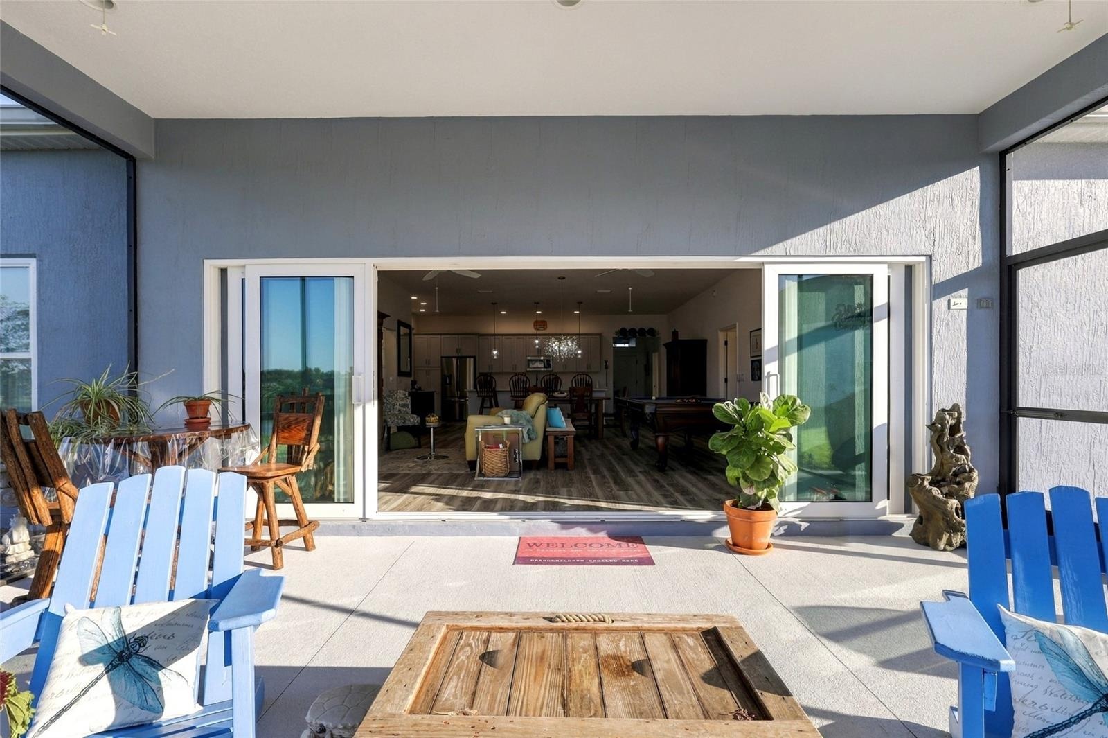 Lanai with 4 Panel Sliders Open to Living Room