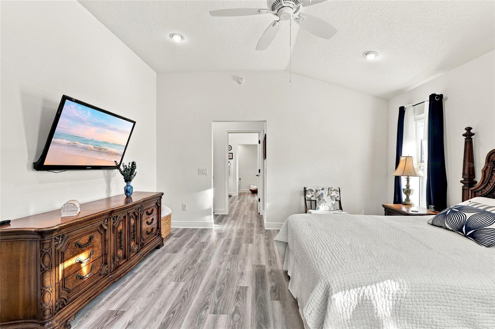 Primary Bedroom with view toward en-suite and closet