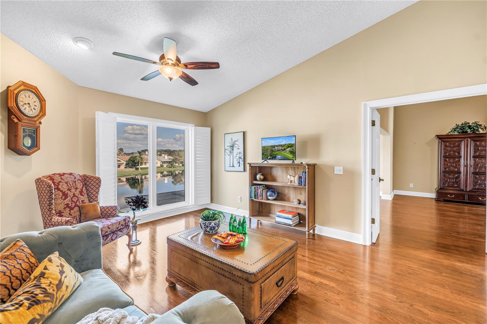 This unique upstairs bonus living space in Caya Costa features vaulted ceilings and premium hardwood flooring. The room offers expansive views of the 