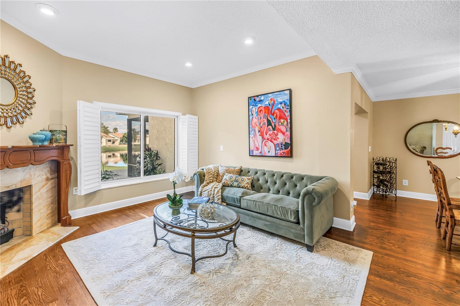 Formal living area featuring a wood-burning fireplace with an optional insert.