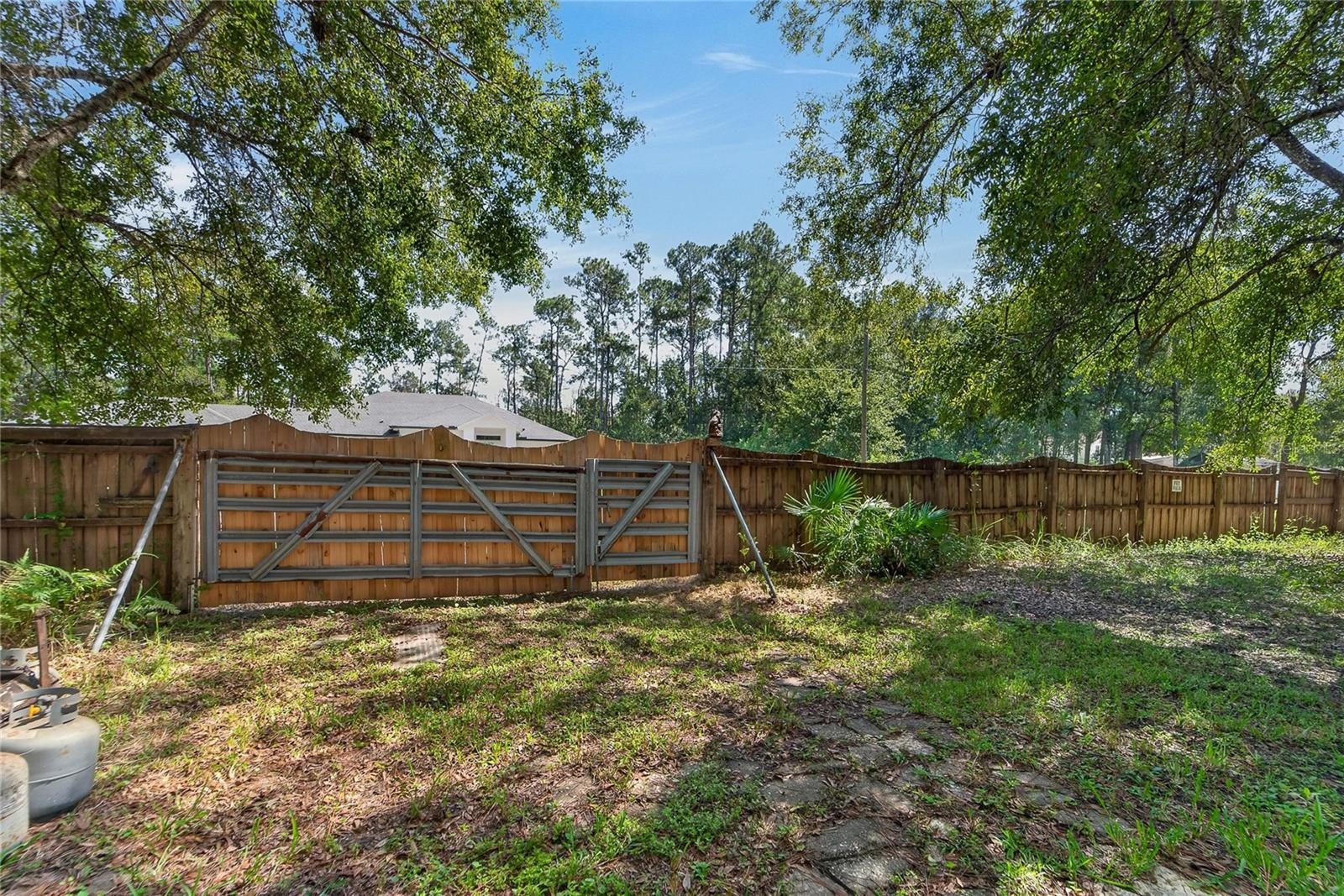 Wooden Fence with gate on Olcott Drive