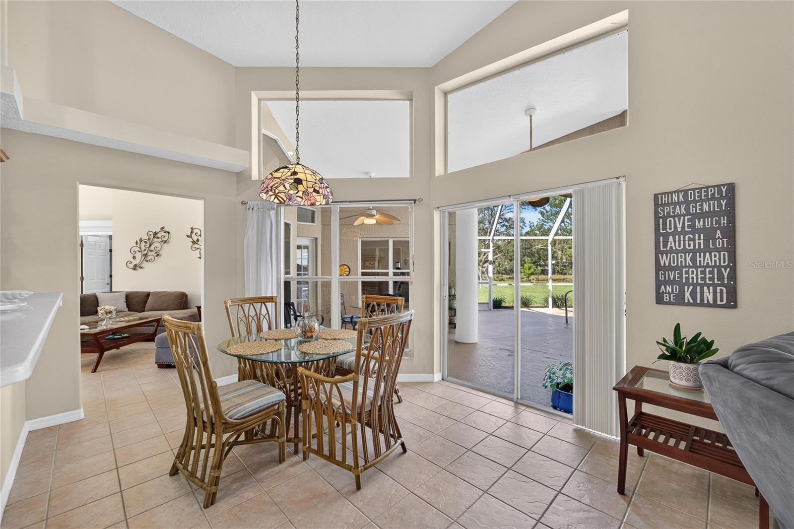 Breakfast nook has sliders to the pool
